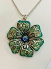 Flower Pendant With Blue Rhinestone Center On Silver Plated Chain