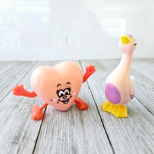 Vintage 2er Set Laufspielzeug zum Aufziehen. One Walking Watscheln rosa Ente Gans und W - Bild 1 von 15