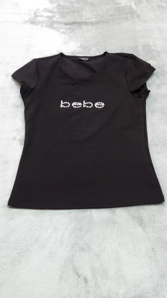 Blusa BEBE Para Mujer Pequeña Estrás Negra Cuello Abierto Corte Frontal Top Camisa Foto 1 de 4