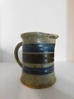 Art pottery hand thrown cream pitcher brown speckled w/ blue and brown stripe
