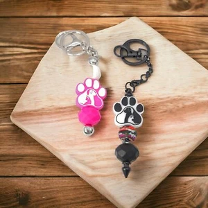 Paw print keychain with cat and dog inside. - Picture 1 of 6