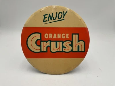 VINTAGE ENJOY ORANGE CRUSH ROUND 9' CELLULOID HANGING OR COUNTER SIGN USA - Image 1 of 4