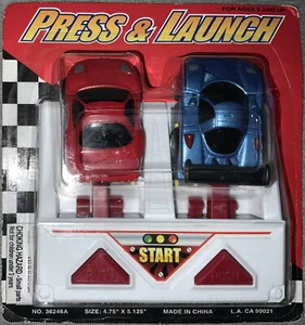 Press & Launch, Juego de Carro Lanzador De Carreras NIB - Picture 1 of 2