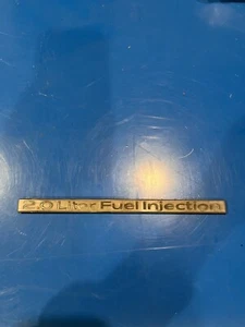 1983 Cadillac Cimarron 2.0 LITER FUEL INJECTION Stick on Metal Emblem - Picture 1 of 6
