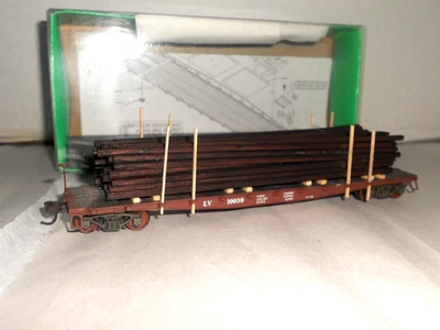 Lehigh Valley F-30a 50' Flat Car w. Jaeger Products Utility Pole Load Bowser HO - Image 1 of 4