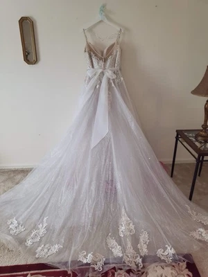 Elegant  Stella York Bridal Gown with Lace Appliqué and Beaded Bodice - Image 1 of 4