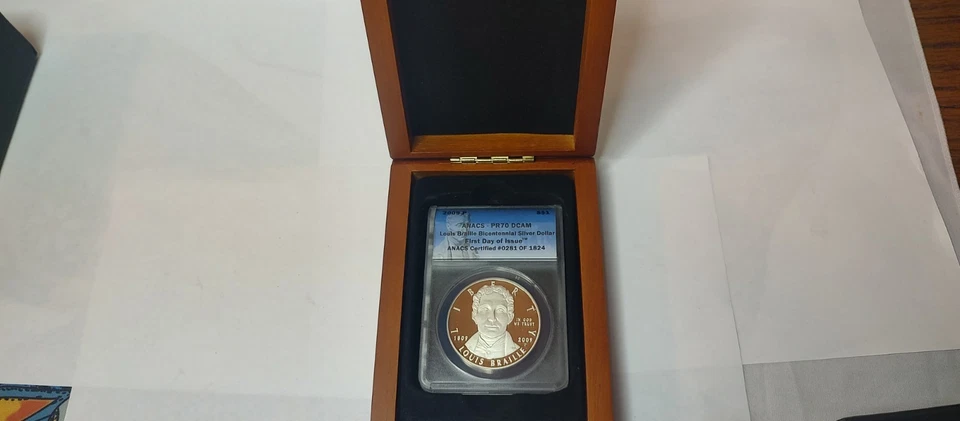 2009 p Louis Braille .900 Silver Dollar ANACS-PR70 DCAM FDOI # 281 of 1824 - Image 1 of 4