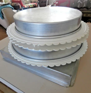 assorted cake pan and seperator plates and pillars - Picture 1 of 7