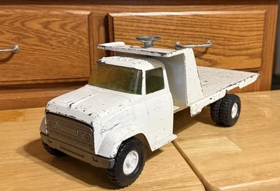 Camión de plataforma inclinable retroceso Ertl GMC original de colección Foto 1 de 4