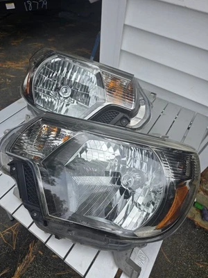 Juego de faros delanteros oscuros izquierdo y derecho Toyota Tacoma 2012-2015 originales OEM Foto 1 de 4