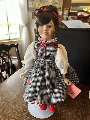 Porcelain Paradise Galleries Annie New Doll Missing Apple Basket Plays Music - Image 1 of 4