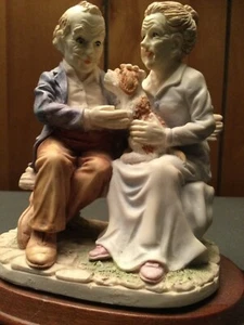 Vintage PORCELAIN FIGURINE Grandpa & Gramma with dog on bench statue collectible - Picture 1 of 5