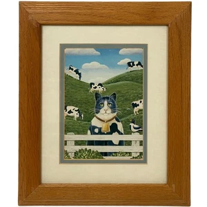 Black and White Tuxedo Cat in Pasture with Panda Cows - Picture 1 of 1