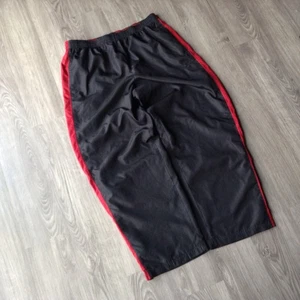 Pantalones de iniciación de colección para hombre L negros holgados calce relajado forrados en pista cortavientos años 90 - Imagen 1 de 7