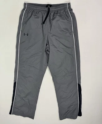 Pantalones deportivos Under Armour para hombre gris medio forrados de malla sueltos entrenamiento de viento activo Foto 1 de 4