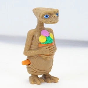Figura de juguete ET Alien Wind Up años 80 coleccionable sosteniendo flores excelente funcionamiento - Imagen 1 de 7