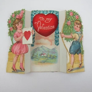Vintage Valentine Boy Shoots Arrow Girl Pink Dress Holds Heart Target Mountains - Picture 1 of 12