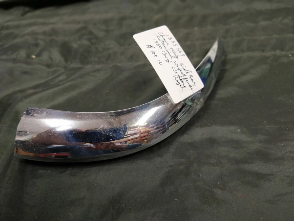 NOS MOPAR CHROME GRILL BAR EXTENSION LH FR FENDER PN 1335569 FOR 1950 CHRYSLER - Image 1 of 1