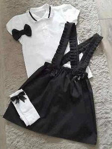 MÄDCHEN SCHULUNIFORM SET 2-14 JAHRE ROCK POLOSHIRT CLIP SOCKEN SCHWARZ WEISS - Bild 1 von 2
