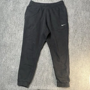 Pantalones deportivos Nike para hombre grandes negros de vellón con logotipo deportivo Swoosh cordón - Imagen 1 de 12