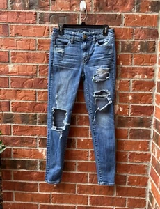 Pantalones de mezclilla rasgados desgastados súper elásticos de tiro alto American Eagle para mujer 4 - Imagen 1 de 8