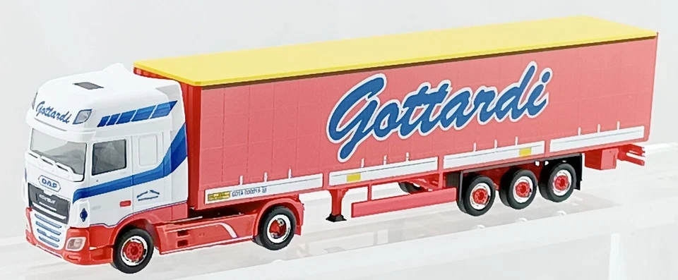 HERPA PIHR950398 "Gottardi" DAF motrice bianca Strisce azzurro, scala HO 1:87 - Immagine 1 di 1