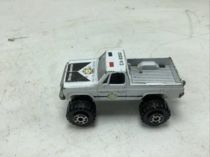 Road Champs 1982 GMC High Roller Highway Patrol 4x4 Truck 1:64 - Bild 1 von 8