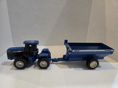1/64 Ertl New Holland  Versatile Tractor 9882 with duals & Kinze 840 Grain Wagon - Image 1 of 4