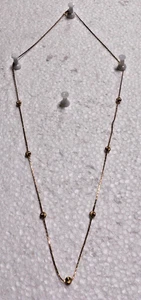 Gold tone chain with 7 round bead neckless. - Picture 1 of 2