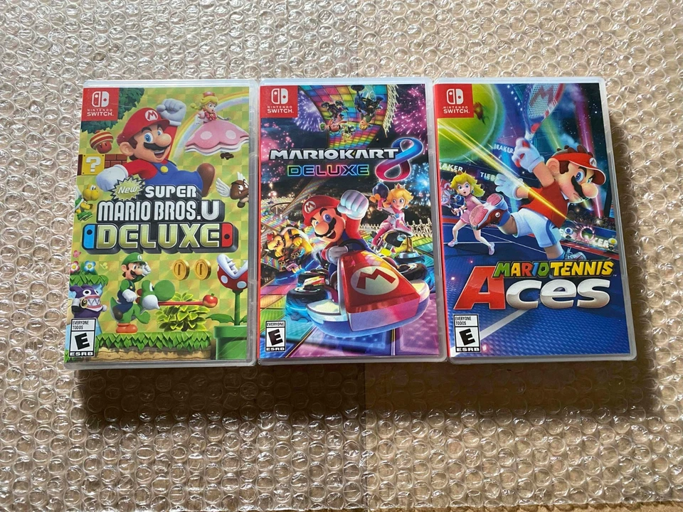 New Super Mario Bros. U Deluxe + Kart 8 Deluxe + Tennis Aces (Switch) - SEALED - Image 1 of 4