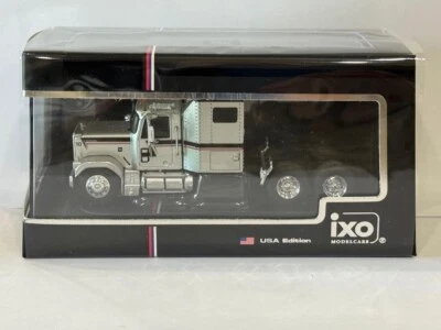 IXO 1980 GMC General - Silver w/ Black & Red Stripes 1/64 - Image 1 of 4