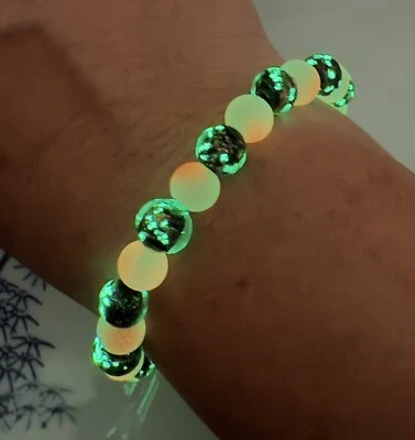 Pulsera Luminosa Brilla en la Oscuridad Rave Hadas Luces Naranja Vidrio Negro Ajustable Foto 1 de 4