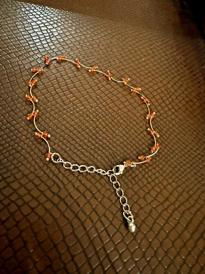 Tobillera tono plata y naranja con cuentas Foto 1 de 4
