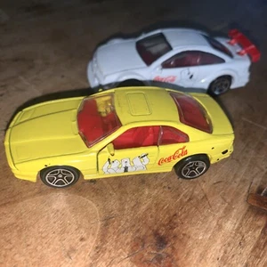 Set 2 Lot Matchbox 1992 yellow BMW 850i & 1996 white Opal Calibra Coca Cola Bear - Picture 1 of 12