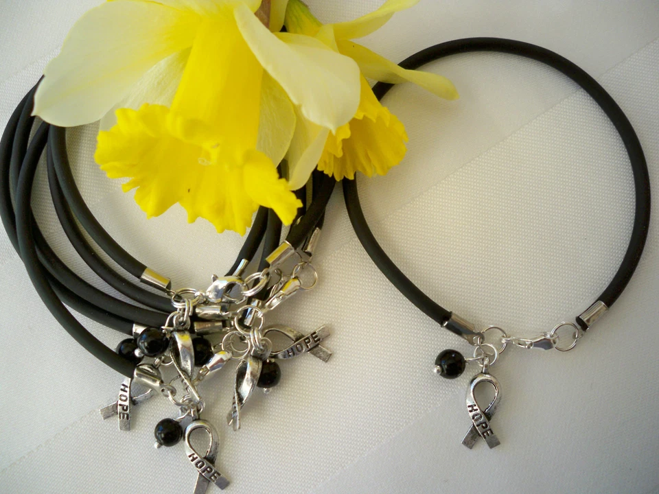 6 COUNT MELANOMA SKIN CANCER AWARENESS- BLACK   BRACELETS   - Image 1 of 1