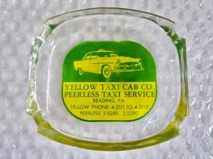 aSHTRAY YELLOW TAXI CAB PEERLESS SERVICE READING PA GLASS VINTAGE AD neocurio - Picture 1 of 4