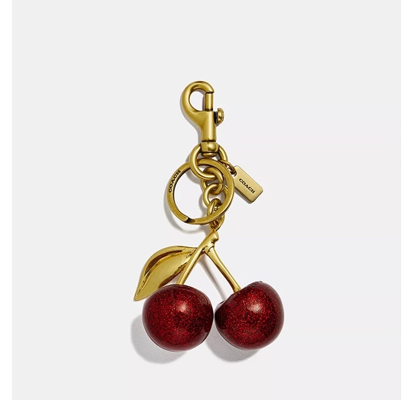 Coach Glitter Cherry Bag Charm Keychain Resin and Metal Brass/Red Apple NWT🎀 - Image 1 of 4
