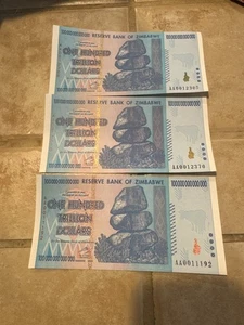 LOT OF 3 🔥 ZIMBABWE DOLLAR 100 TRILLION BANKNOTE 🔥 RARE - LOW SERIAL # 🔥 UNC - Picture 1 of 6