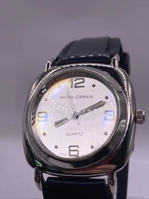 Reloj de cuarzo Michel Germain para hombre tono plata correa de goma negra batería nueva Foto 1 de 4