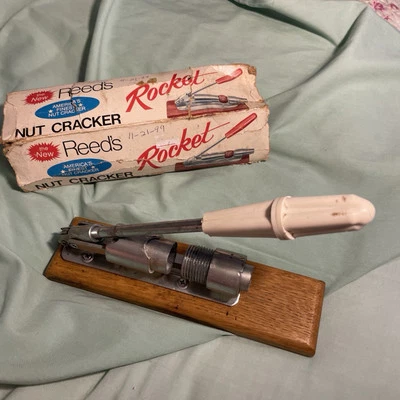 Vintage 70s Reeds Rocket Nut Cracker R-800 White Handle Oak Base Little Rock AR - Image 1 of 4