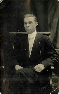 Young Man in Suit Sitting in Chair RPPC d 1915 Postcard - Picture 1 of 2