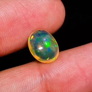 Cabochon ovale etiope OPAL pietra preziosa sfusa 10X8X5 mm 1,10 cts fuoco naturale Welo - Foto 1 di 3