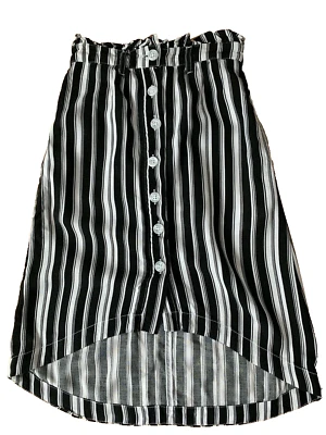 FALDA Justice blanca y negra con botones delanteros de viscosa talla 6 niña  Foto 1 de 3