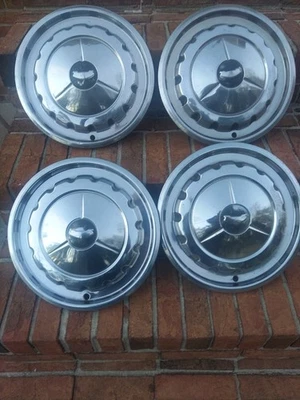 SET OF FOUR 1957 CHEVY HUB CAPS/WHEEL COVERS HUBCAPS  - Image 1 of 4