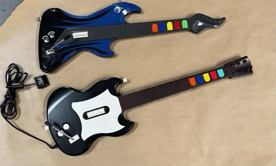 LOTE DE 2 Guitar Hero Playstation 2 PS2 Negro Blanco Octano Negro Azul React Foto 1 de 3