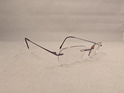 Gafas sin montura Marchon Airlock marco púrpura 135 lentes de demostración ligeras Foto 1 de 4