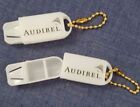 Two Hearing aid battery or pill holder key chains