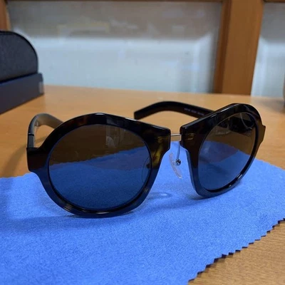 Gafas de sol PRADA con montura redonda marrón Foto 1 de 4