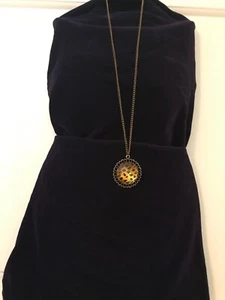 PENDENT AND CHAIN BRASS TONE, PENDENT IS PRINTED BLACK DOTS,16" LONG, - Picture 1 of 4