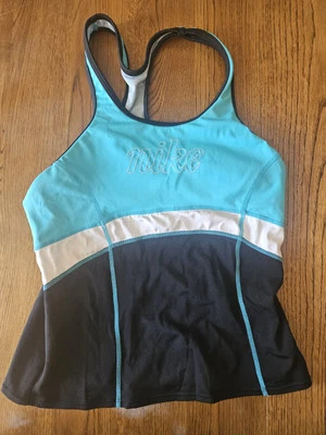 Sujetador sin mangas Nike para mujer con espalda de corredor con estante incorporado turquesa y negro talla pequeña Foto 1 de 2